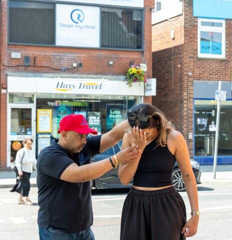 Rahul with a client on the street